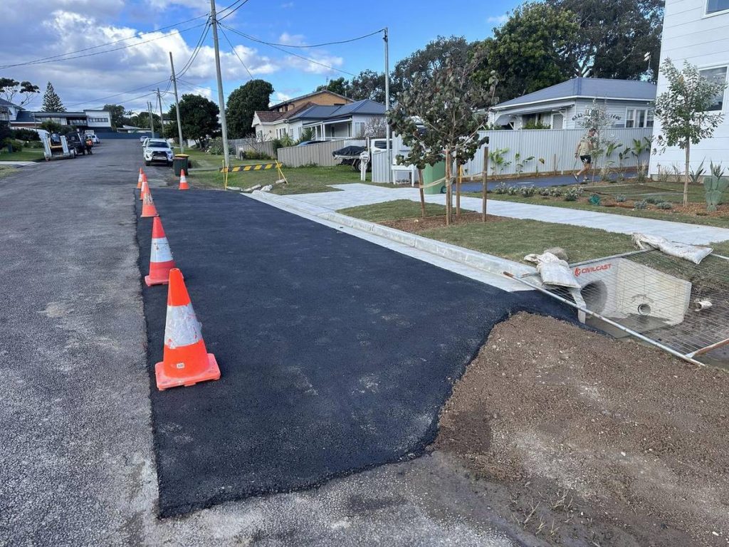 New asphalt driveway crossover at the kerb on a Central Coast street