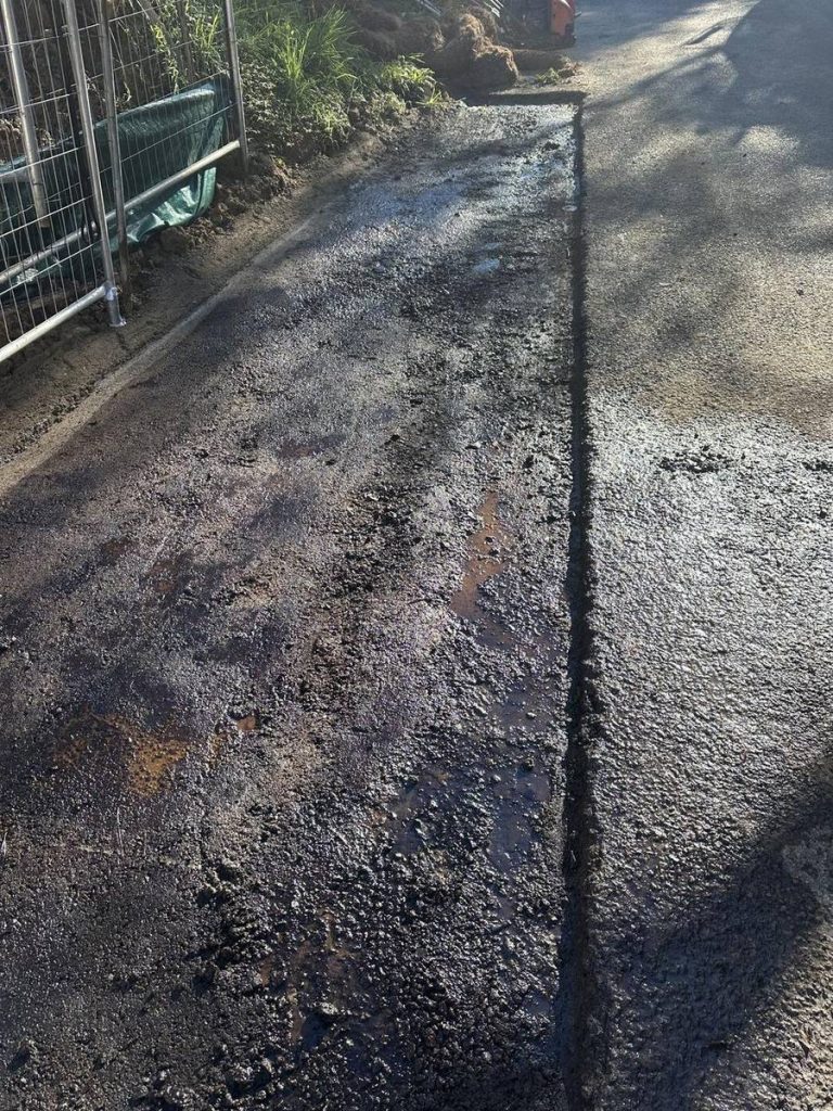 Saw-cut area dug out and ready for hot-mix asphalt